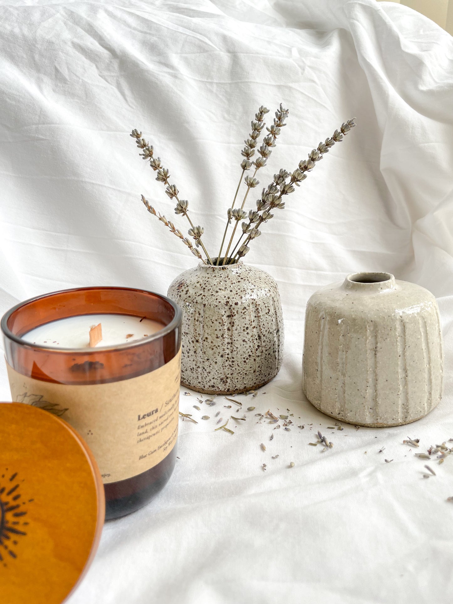 Leura scented soywax candle styled with Hazel small handmade ceramic vases and died Lavender