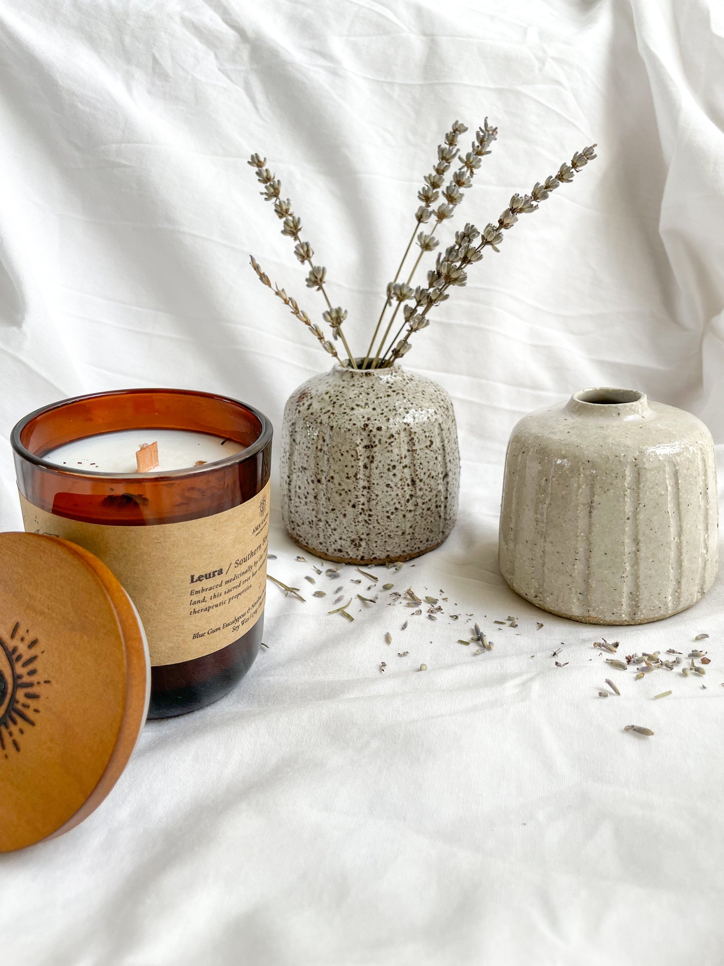 Leura scented soywax candle styled with Hazel small handmade ceramic vases and died Lavender