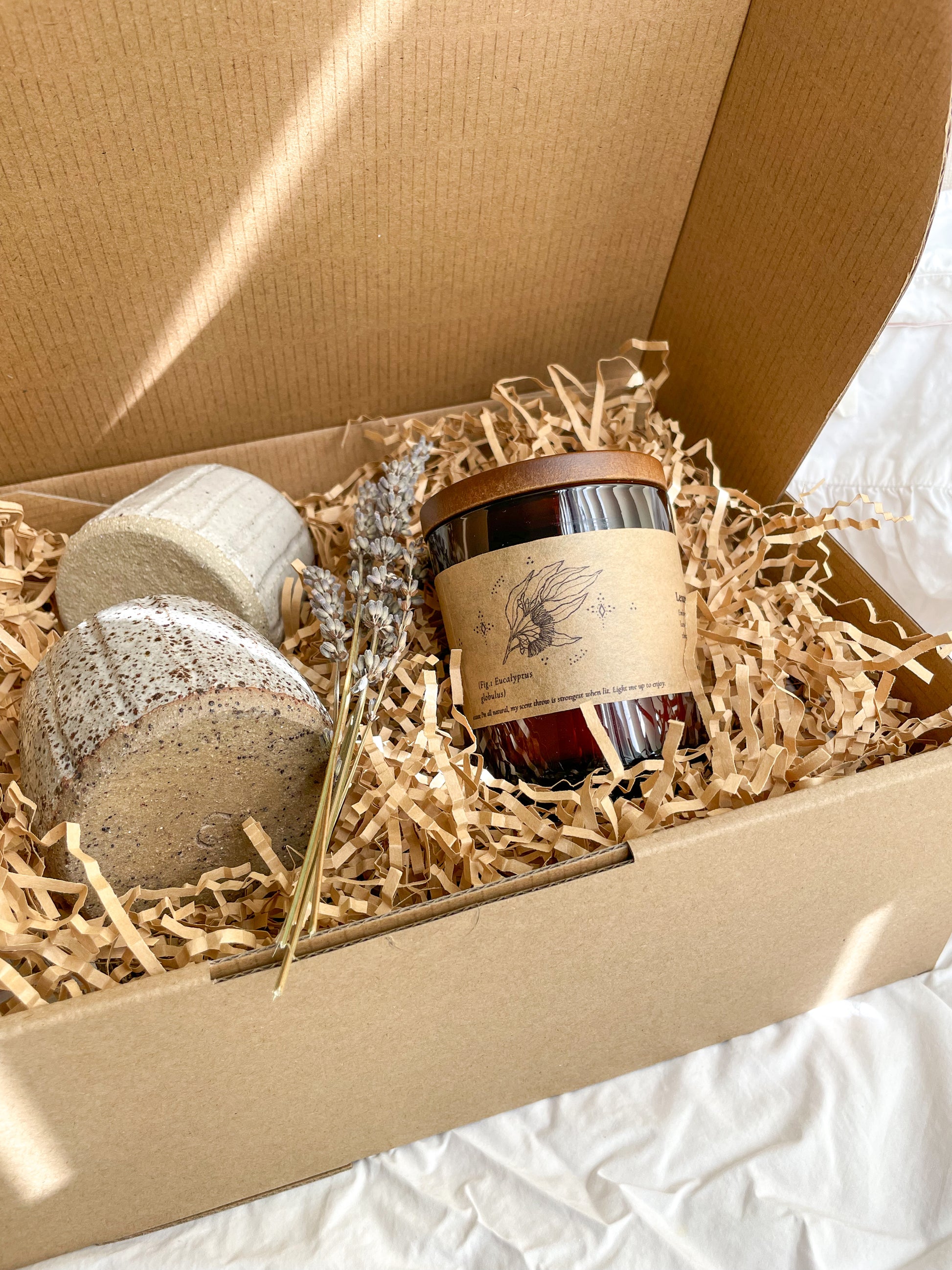 Tranquil gift set which includes two Hazel small handmade ceramic vases and a Leura soywax candle packed in a kraft gift box