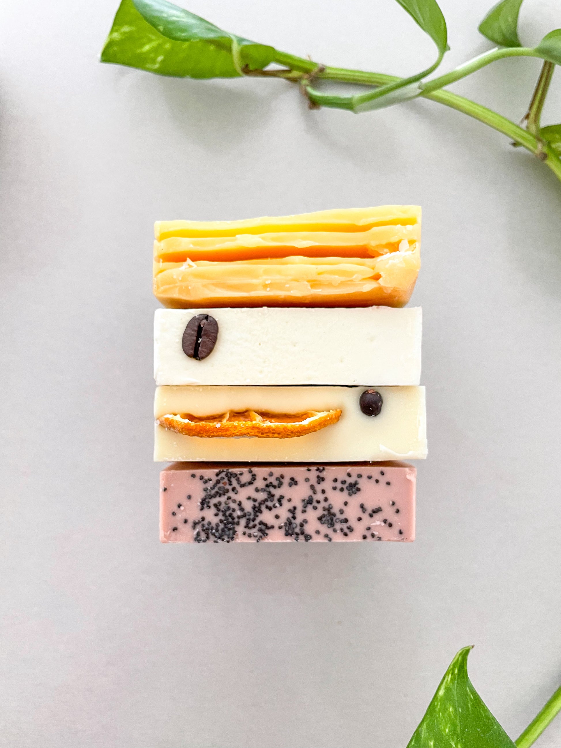 Colourful natural handmade artisan soaps bundle displayed on a table. 