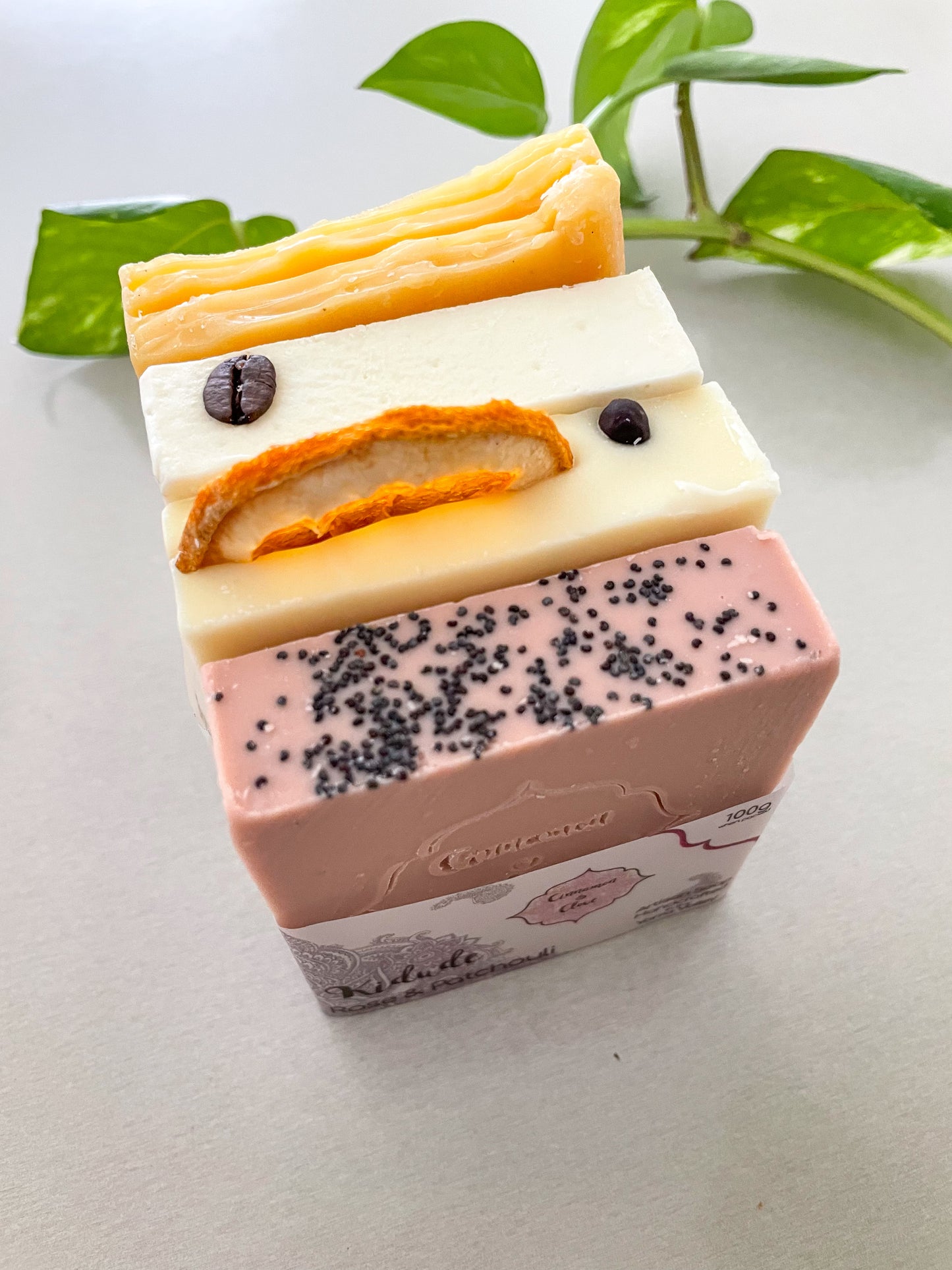 Colourful natural handmade artisan soaps bundle displayed on a table. 