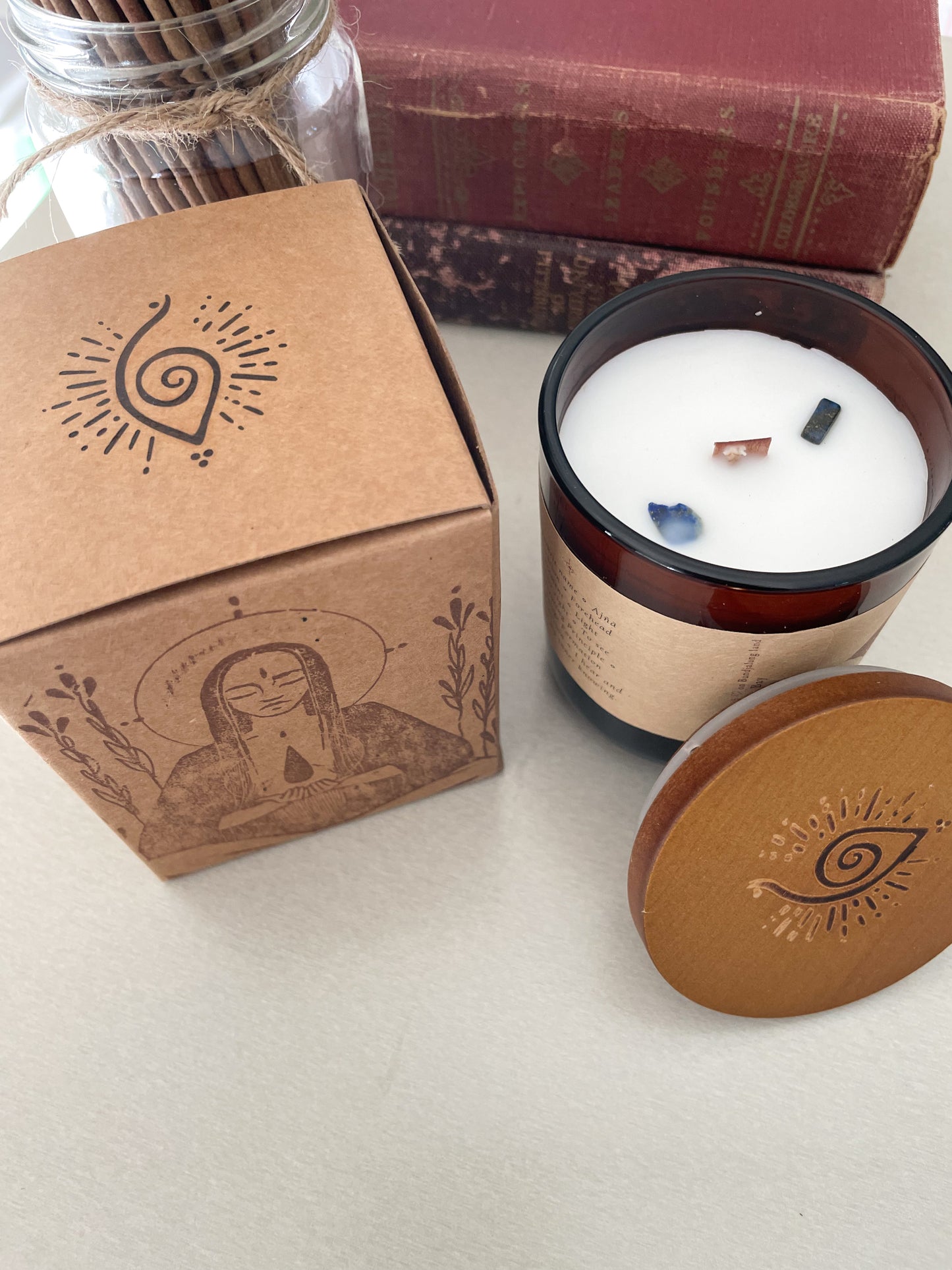 Third Eeye Chakra meditation candle with crystals styled with candle packaging, spiritual books and incense