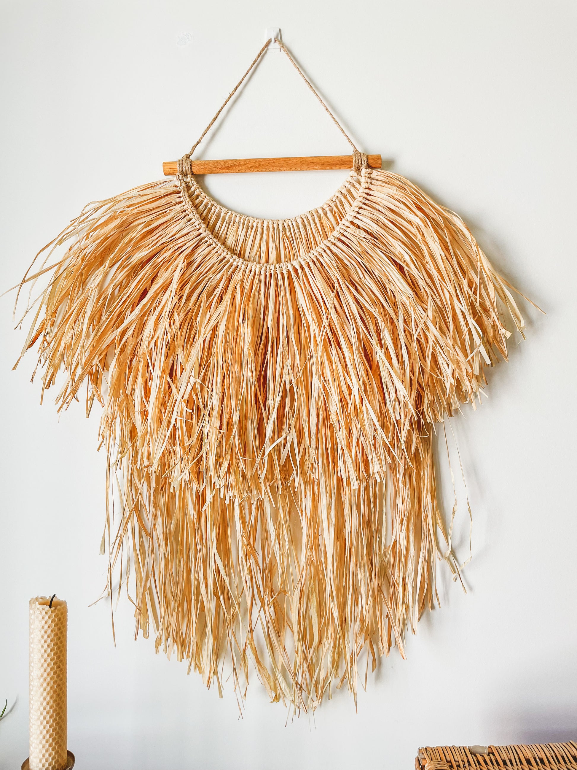 Closeup view of a raffia wall hanging hanged on a wall