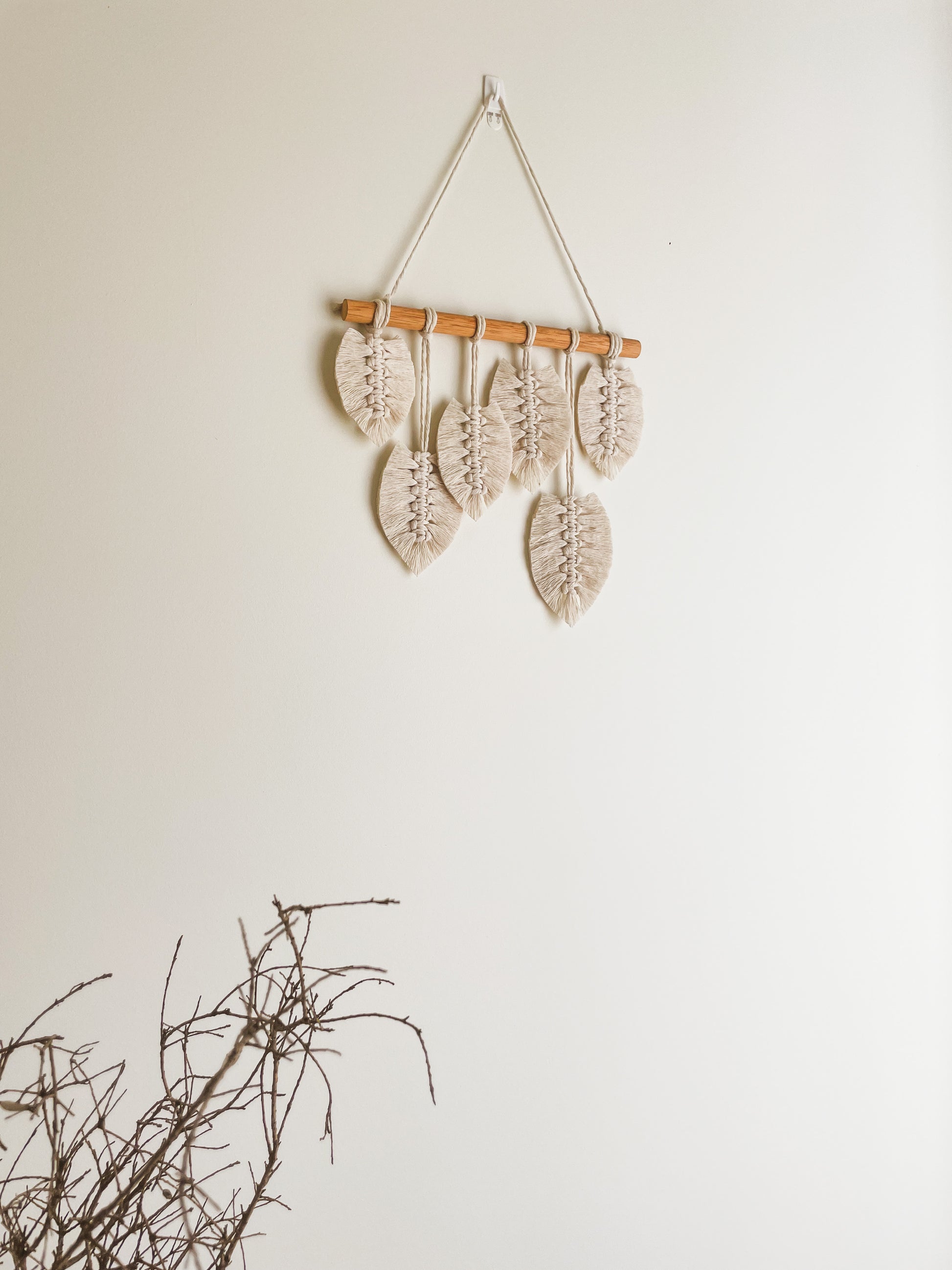 Sunshine macrame leaves hanging hanged on a wall. 