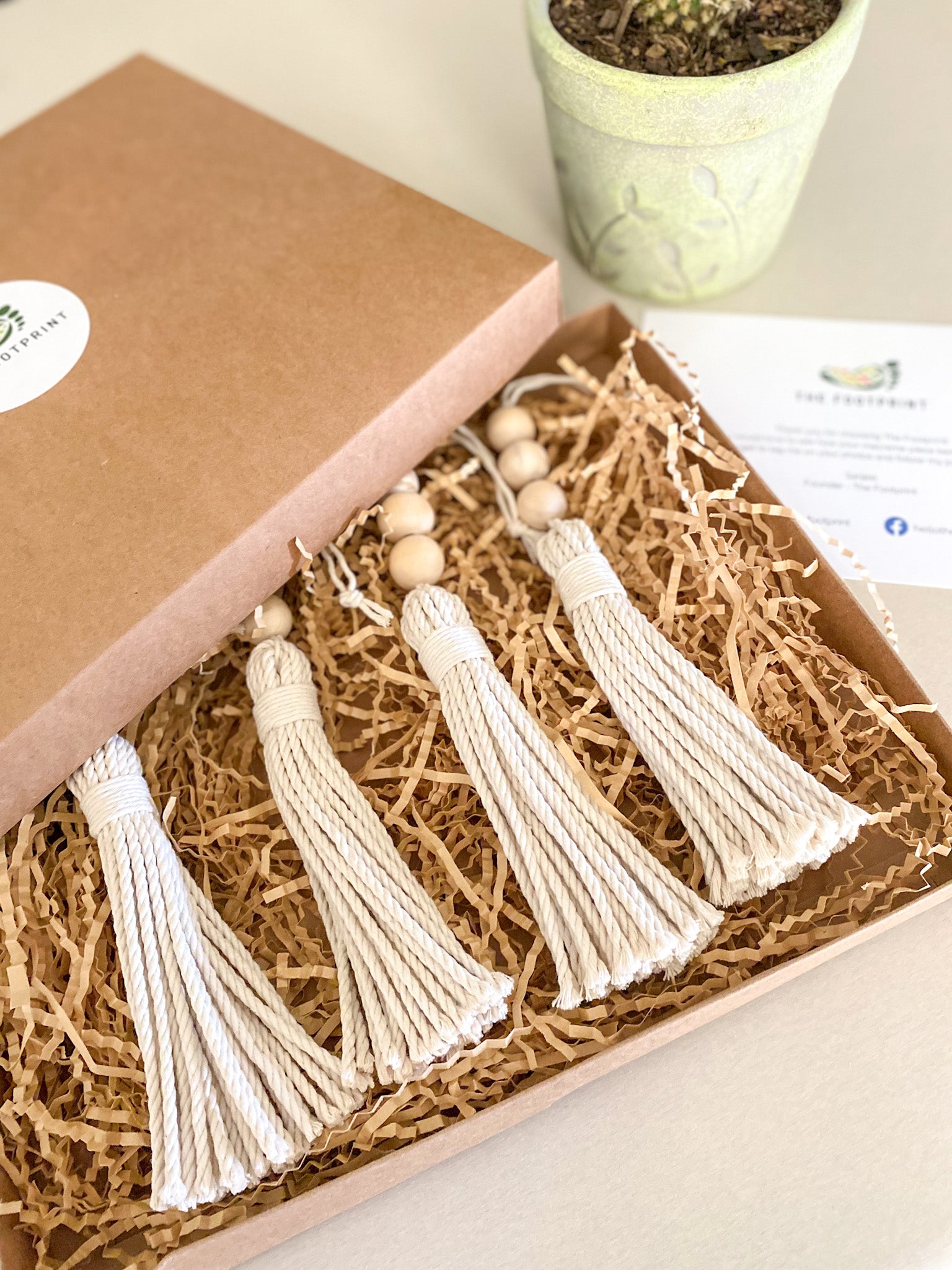 Beaded macrame tassels displayed in the gift box