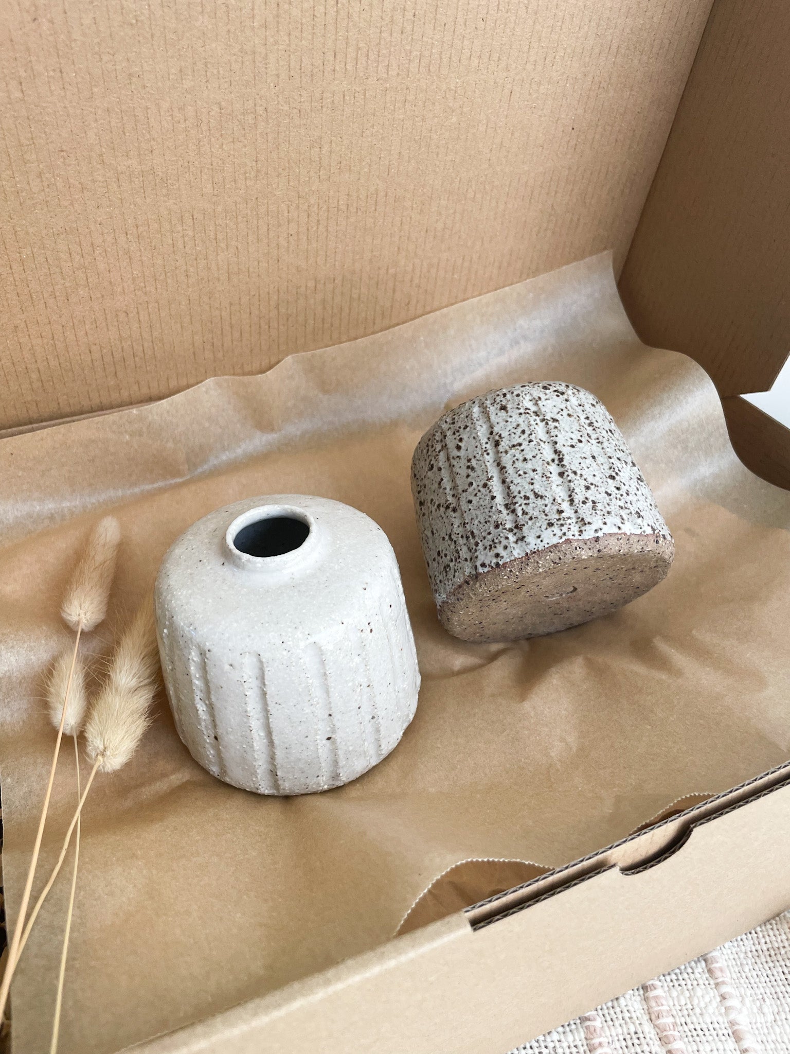 Two small ceramic vases packed in a gift box